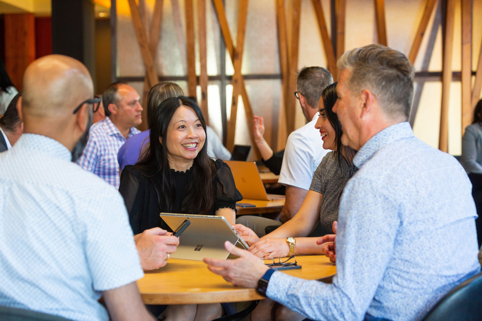 Microserve employees around a table discussing